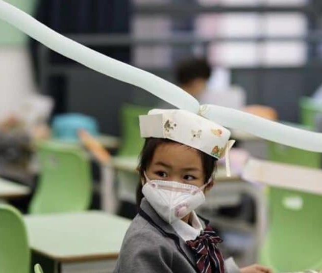 chapeau distanciation sociale chine écoles